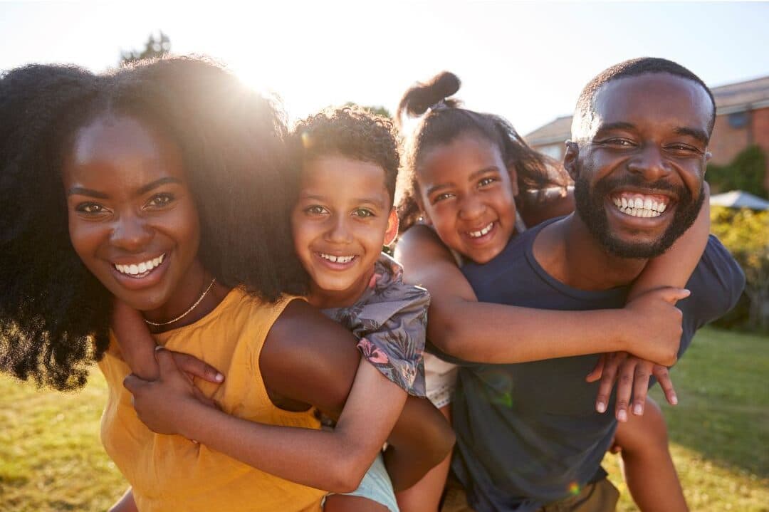 Family smiling together outdoors